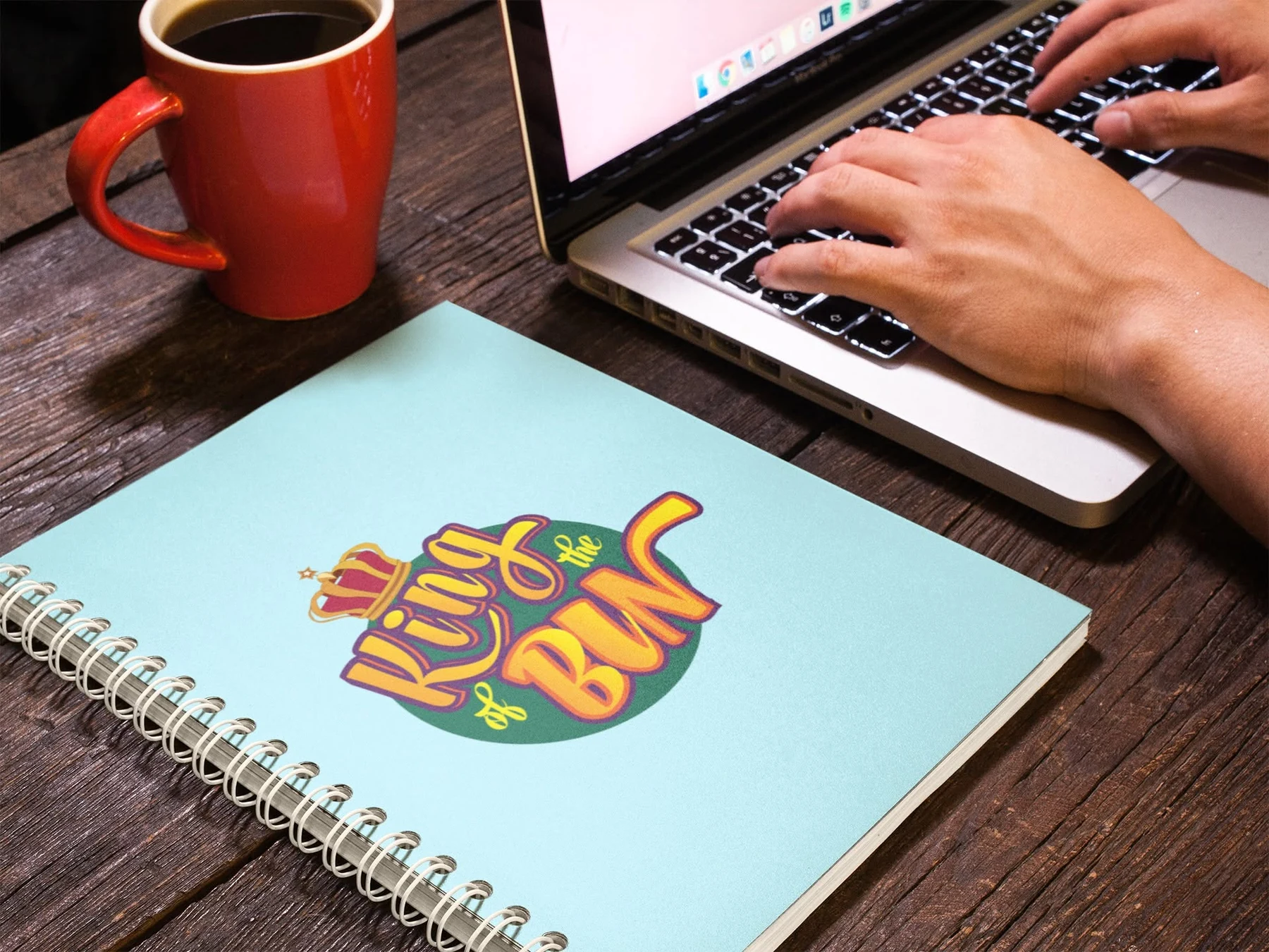 King of the Bin logo applied to a spiral notebook